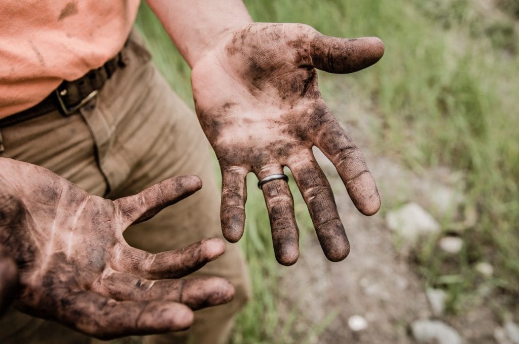 Hard working man with dirty hands